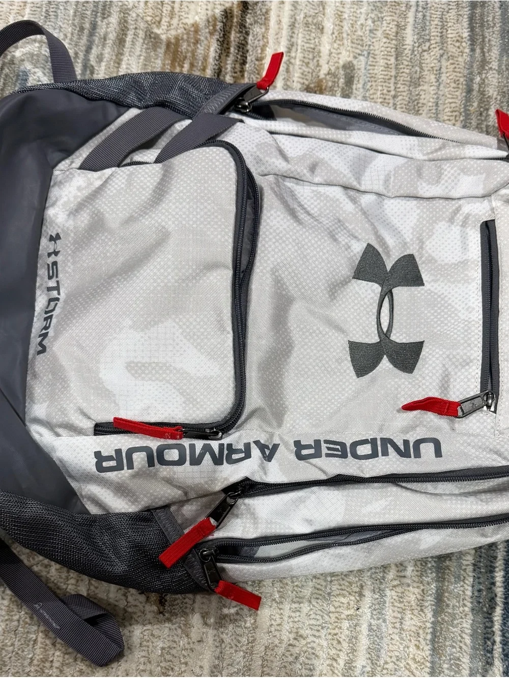 Under Armour Light Gray and Dark Gray Storm Backpack with Red Pulls